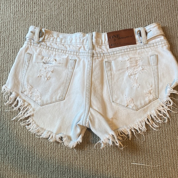 One teaspoon shorts. Low waist. Short rise. Raw curved hem - Picture 2 of 5